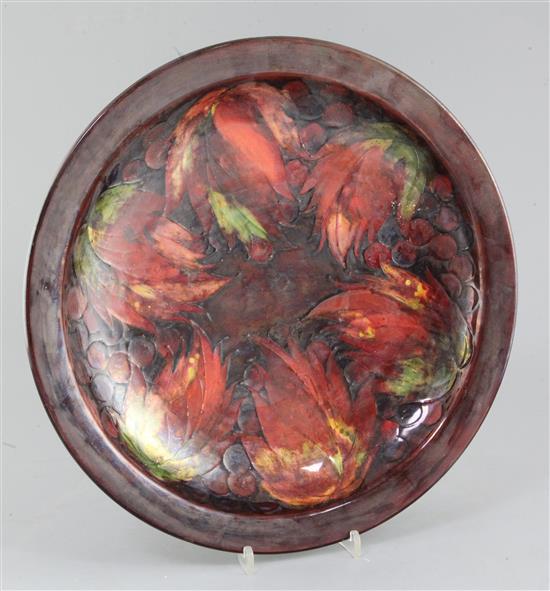 A large Moorcroft flambé leaf and berry dish, c.1928-36, diameter 37.5cm